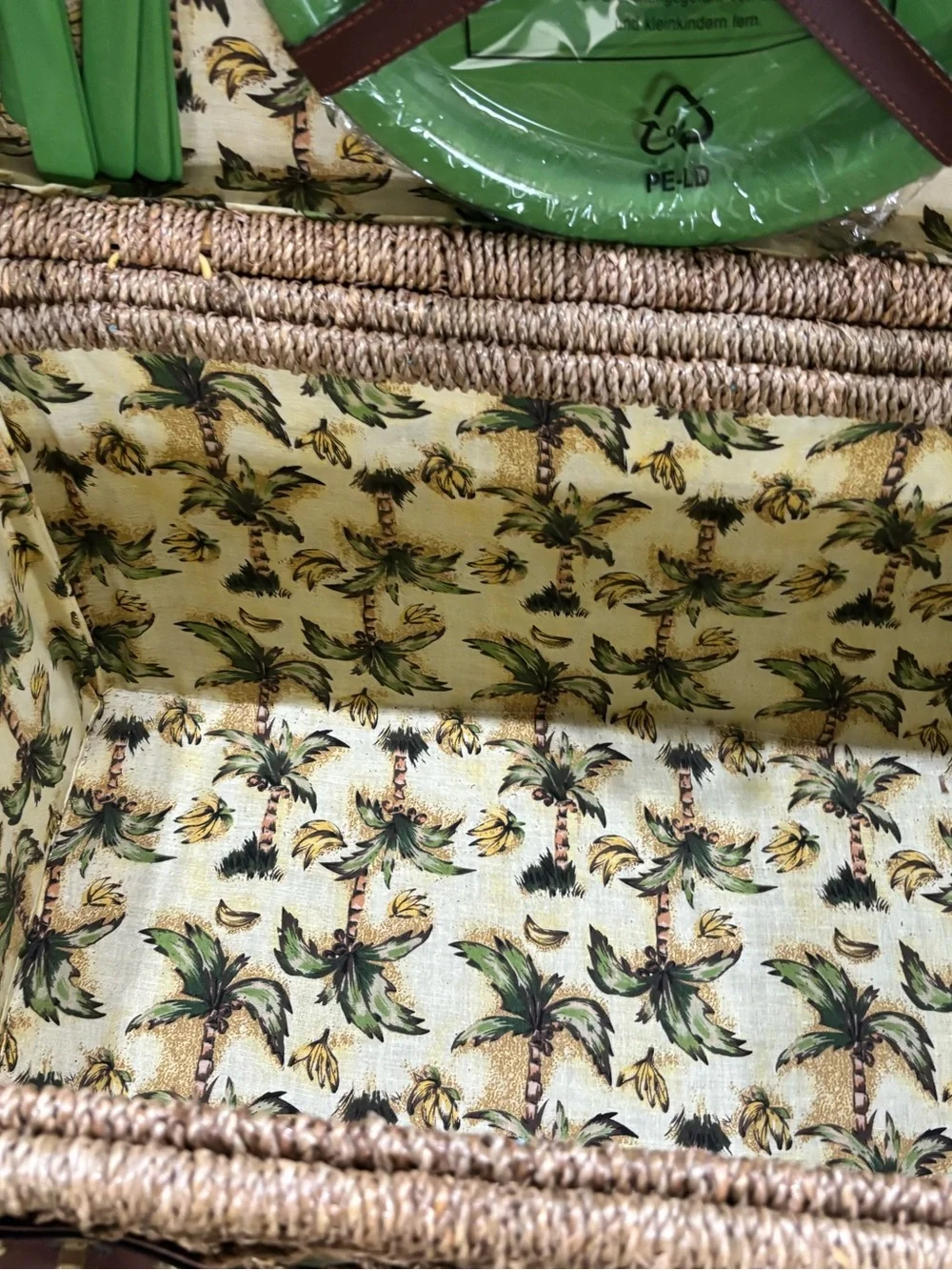 Vintage wicker and tropical palm green picnic basket service for four